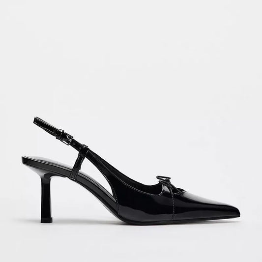 Black patent leather bow with pointed tip thin heel and a shallow strap for women's sandals